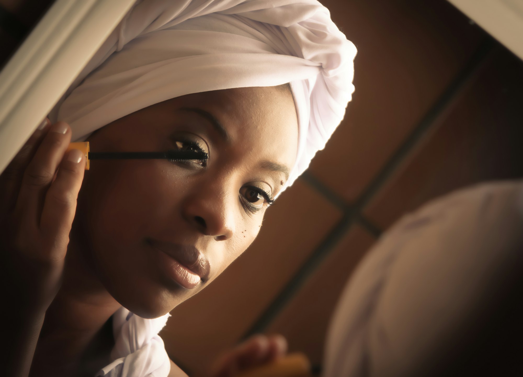 Woman smiling warmly, representing the positive energy of building good habits