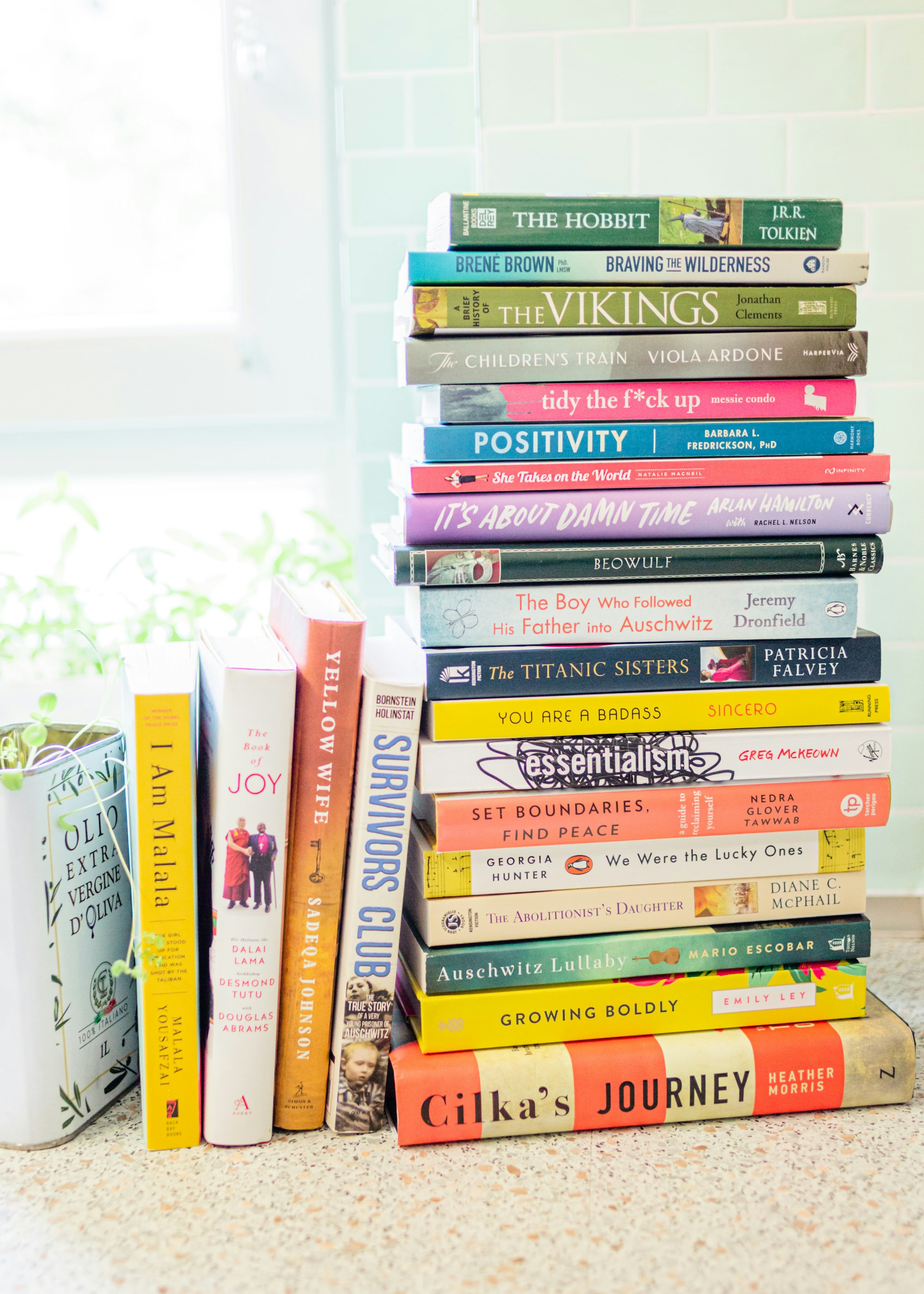 A stack of books sitting on top of a counter