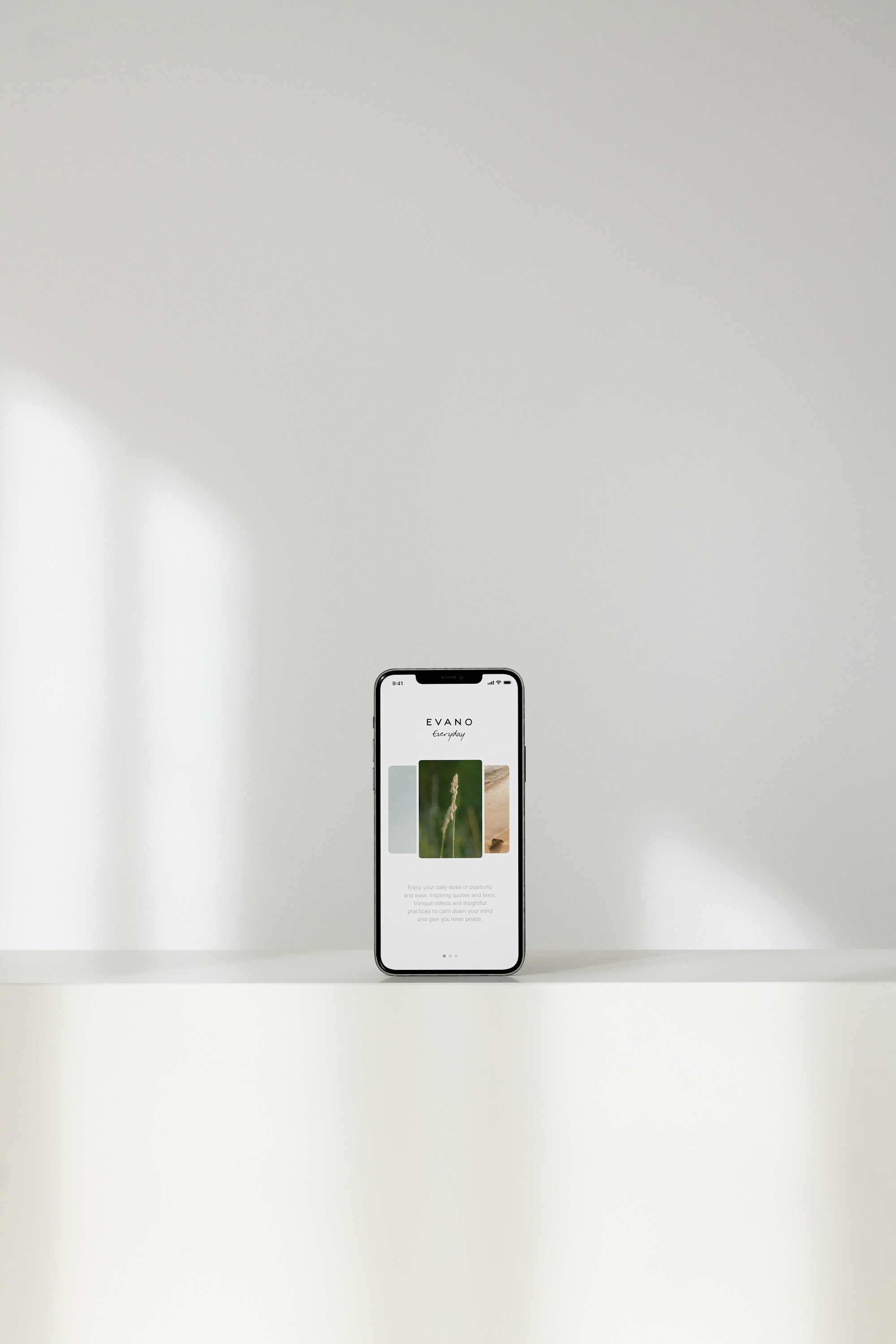 Silver iPhone on white table
