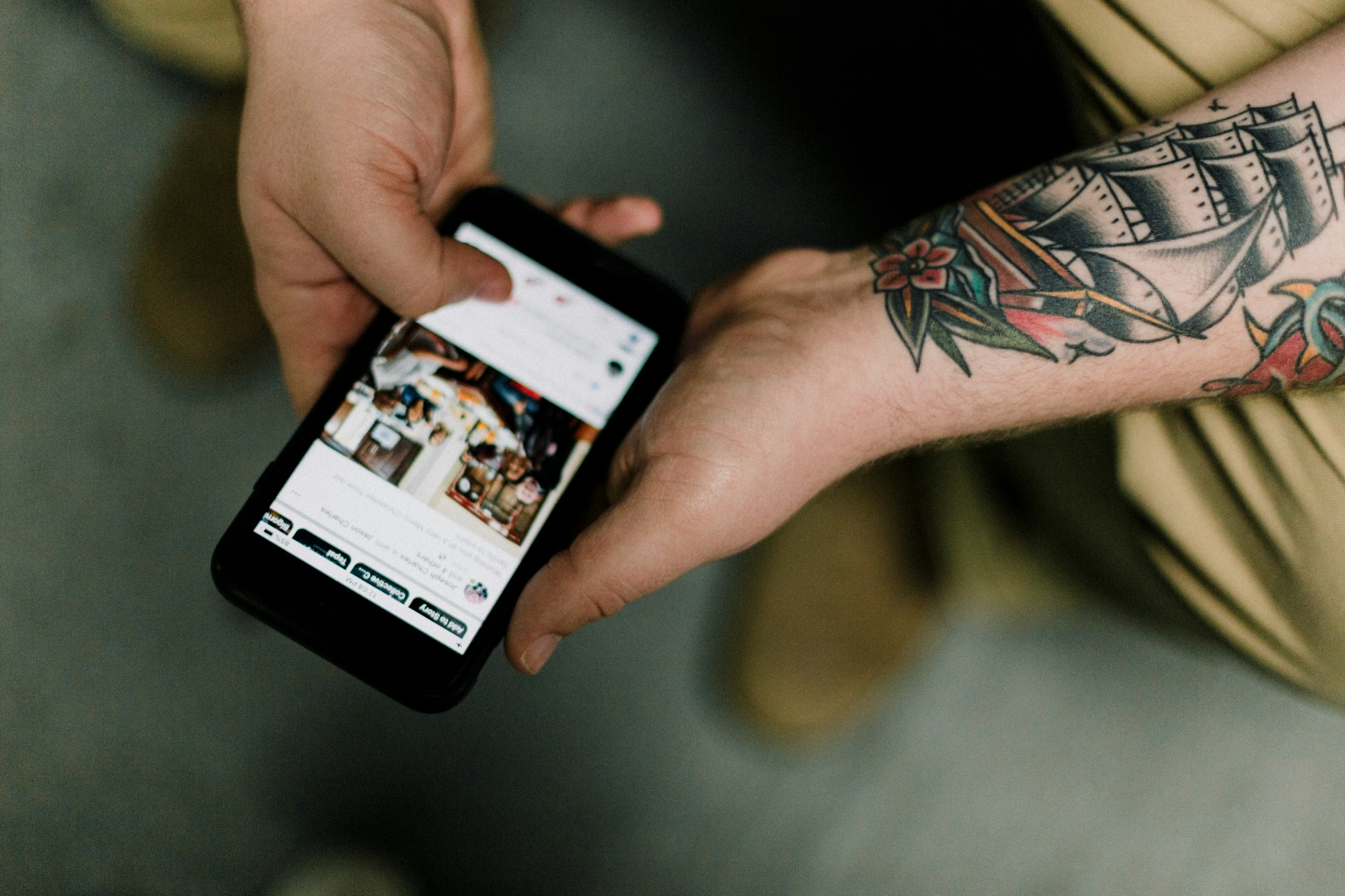 Person scrolling through social media on a phone