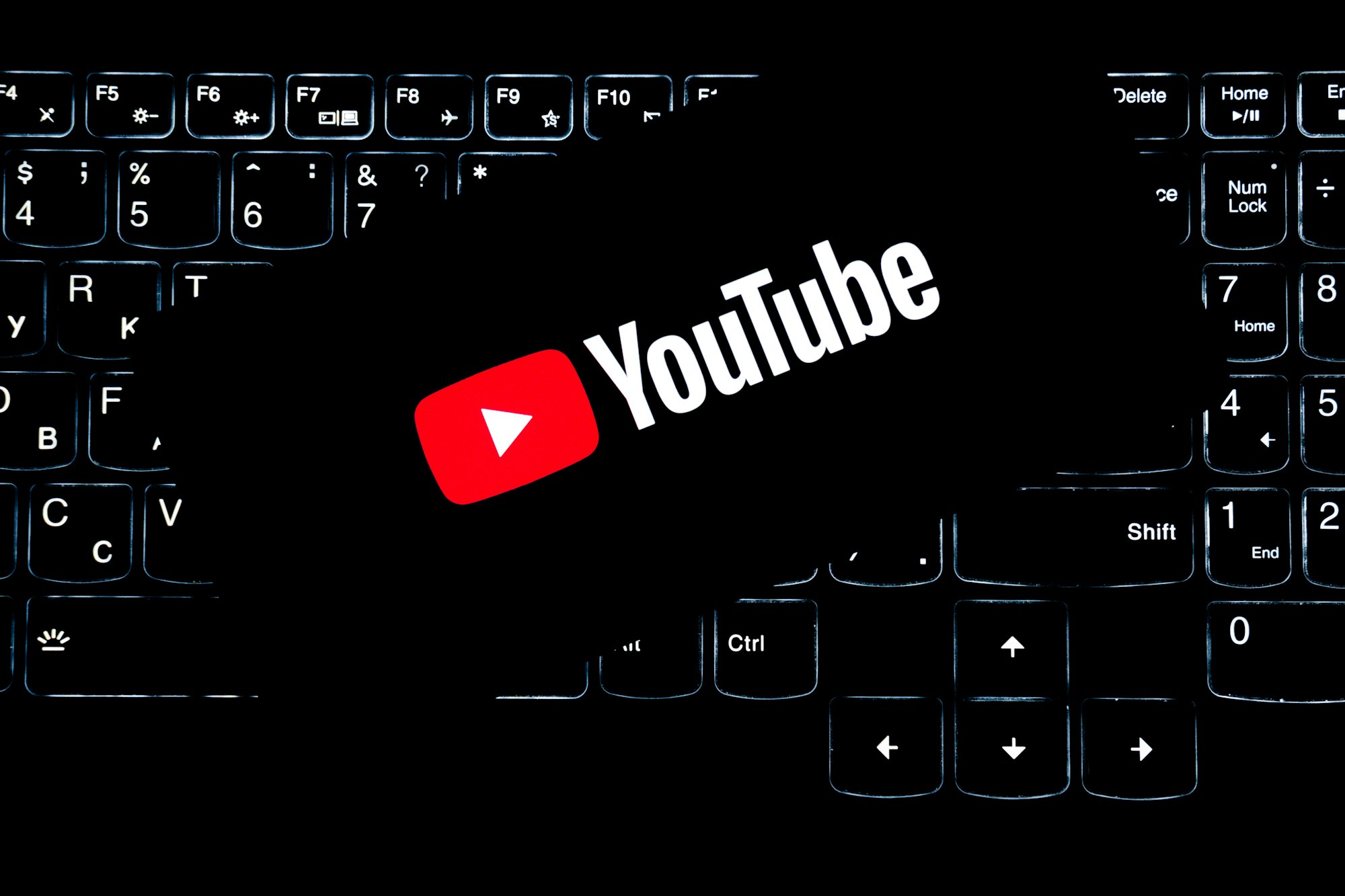Person reviewing YouTube analytics and algorithm signals on a screen