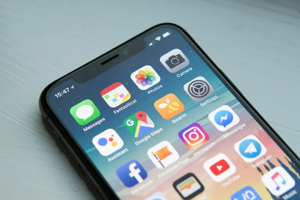 Smartphone home screen filled with colorful app icons
