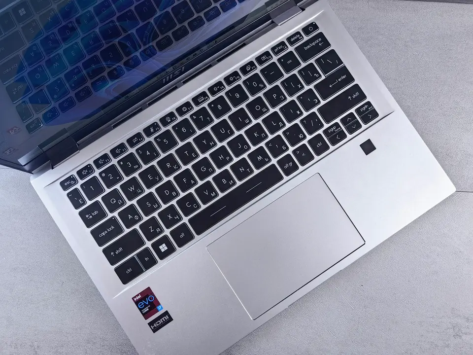Overhead view of an open laptop keyboard and touchpad