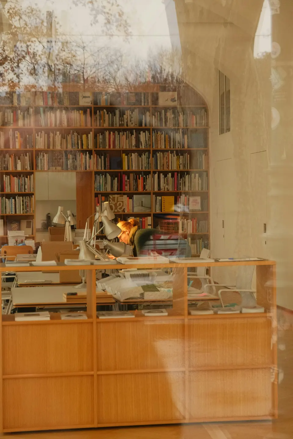 Bookshelves filled with books in a well-lit room
