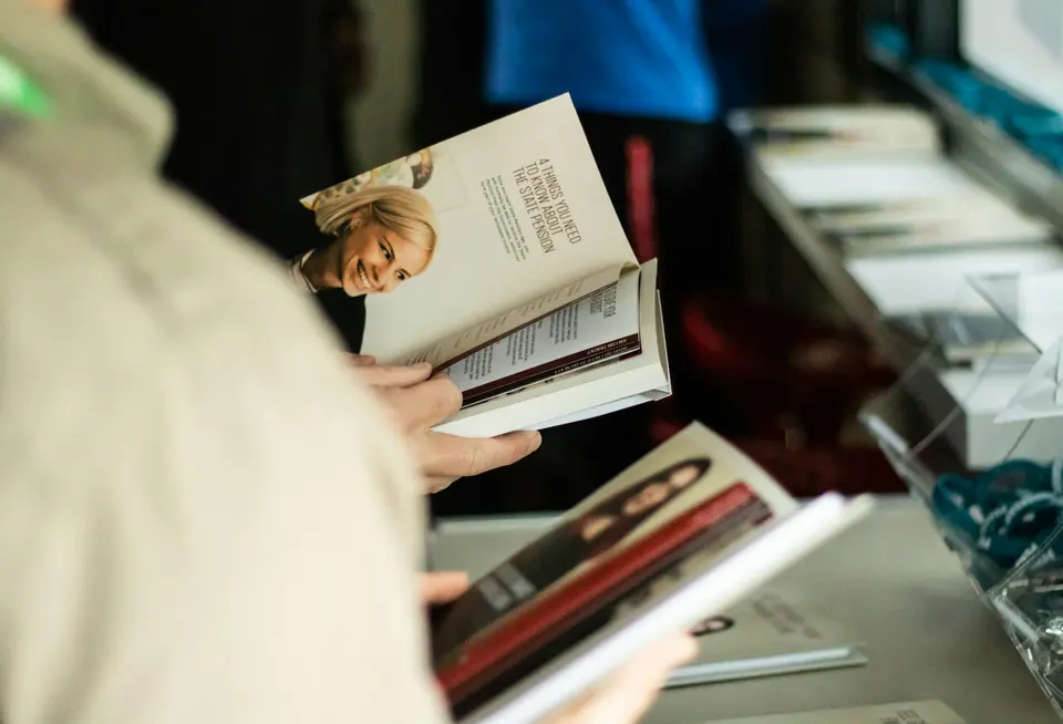 Person reading an open book