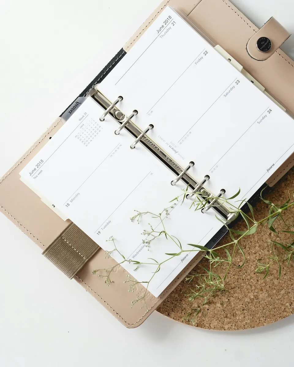 White and brown notebook on a desk