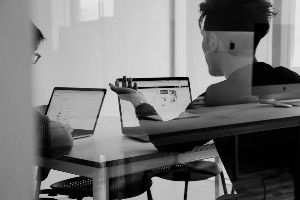 Man using a MacBook in an office