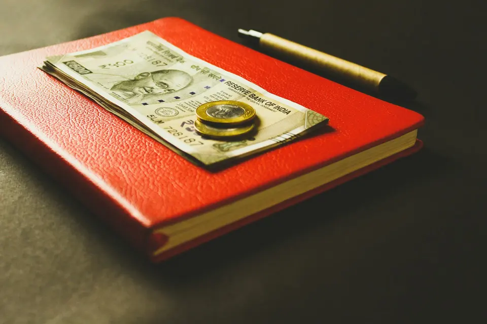 Two coins on banknotes