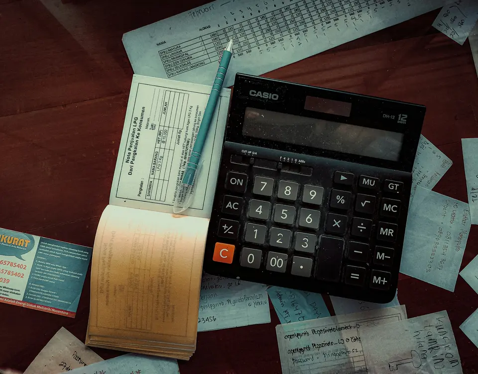 A clean workspace with computer showing invoicing software