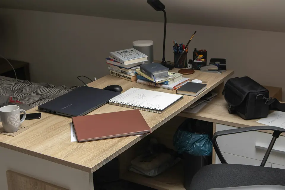 Wooden desk with a laptop computer in a home office